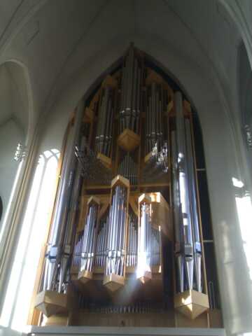 a huge church organ on display inside a building