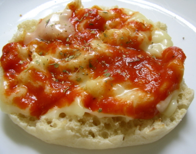 a plate of pizza sauce on a piece of garlic bread