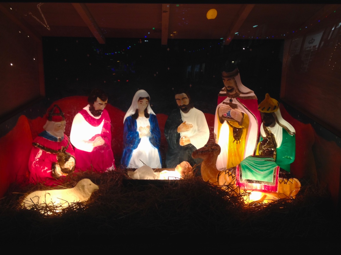 a nativity scene includes three men and women
