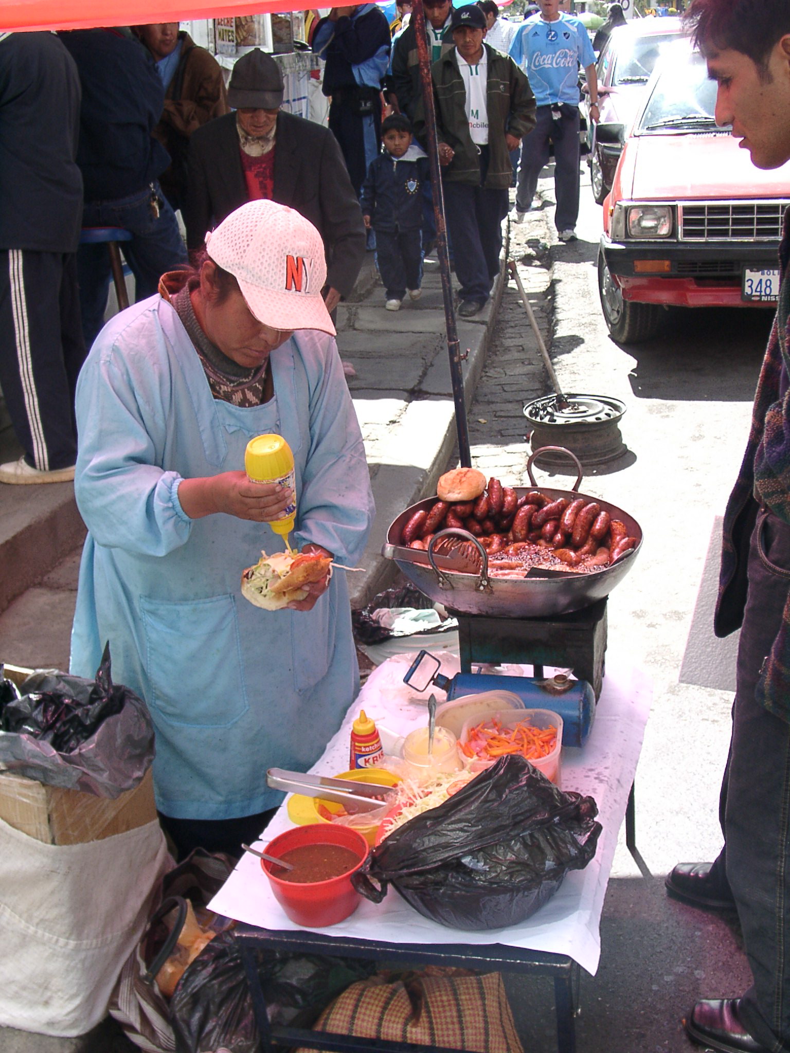 a man is standing by a table with food