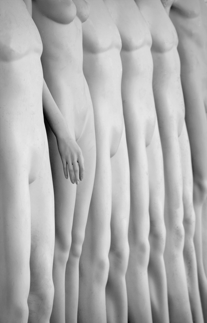 the woman's body and back are separated by vertical lines