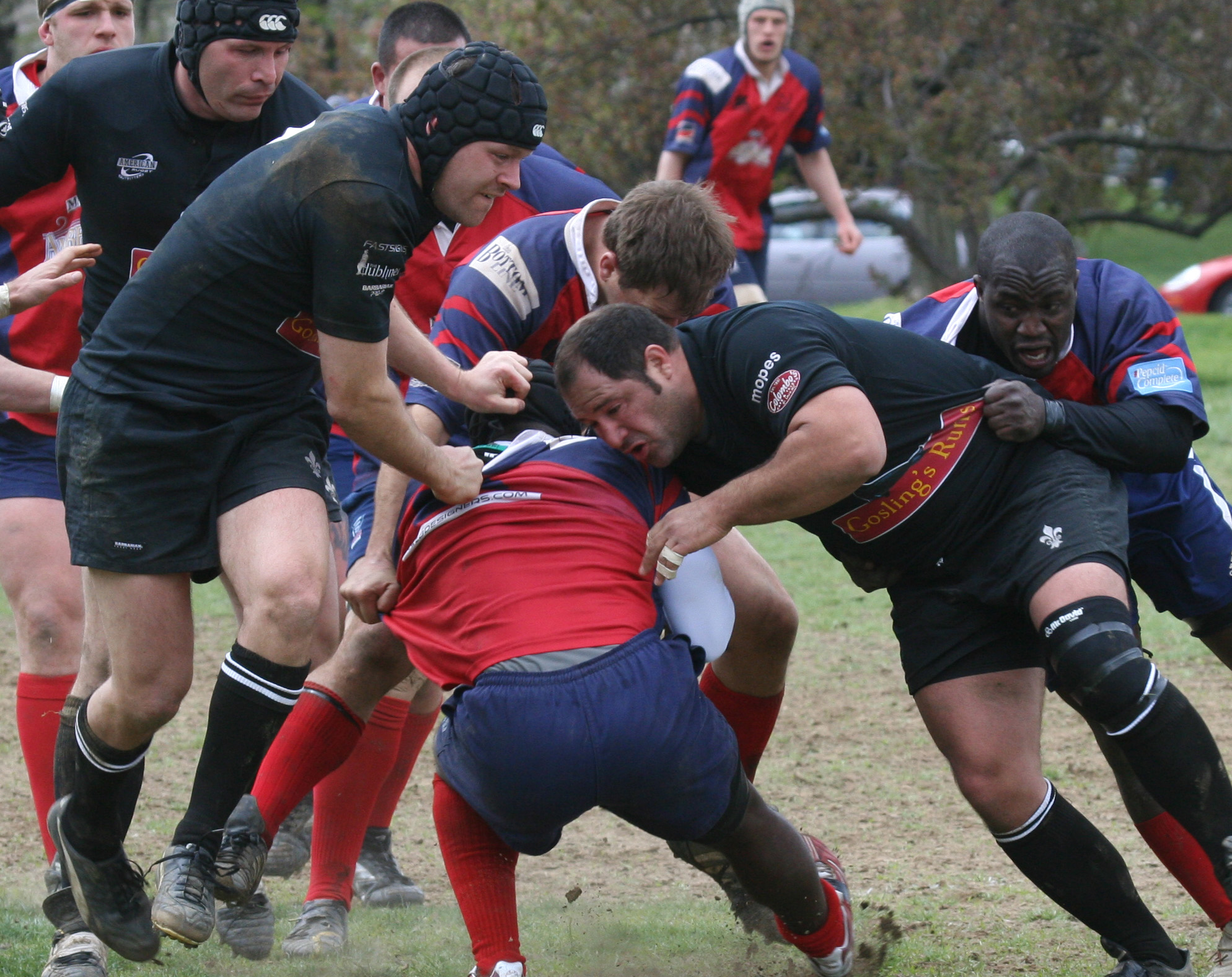 some men are playing rugby against each other