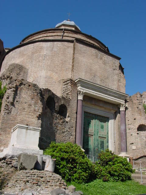 a large circular building with a small round window