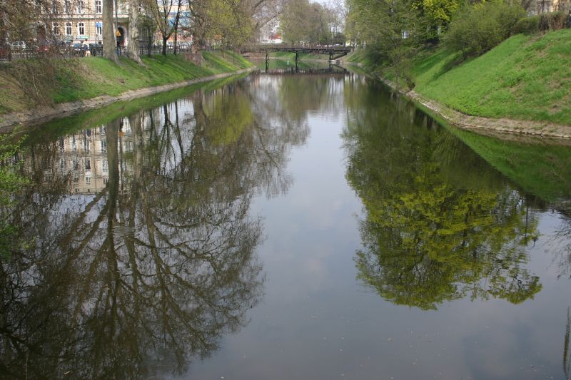 a canal running through a city with houses