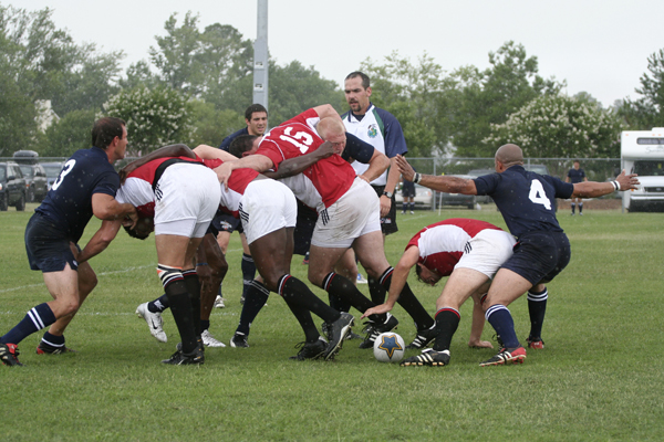 a team of rugby players fight for control