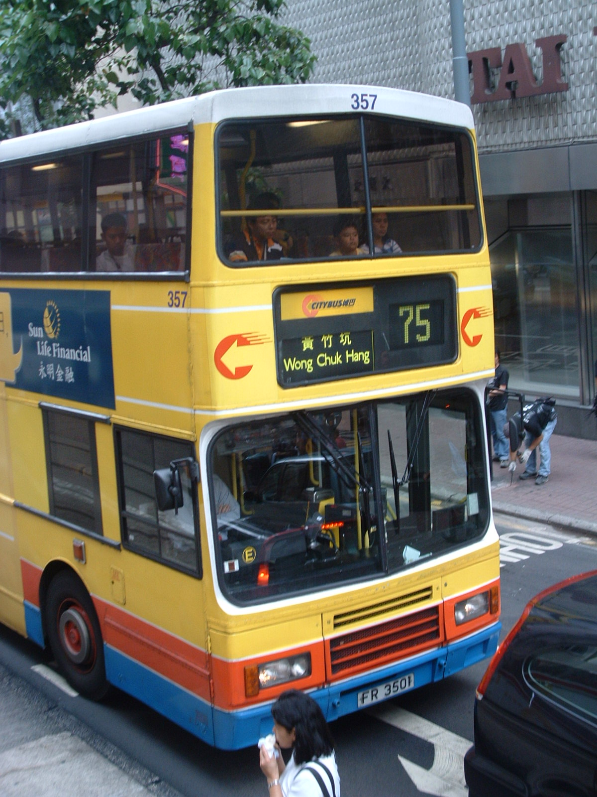 a bus driving down a city street filled with traffic