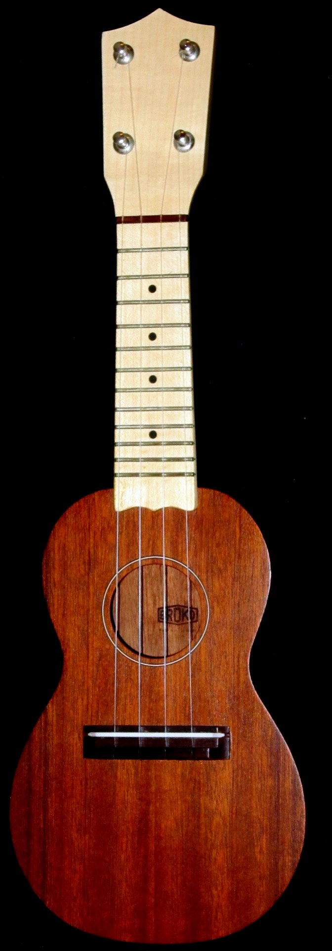 an image of a ukulele with strings that are wood