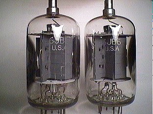 two clear glass tubes connected to a light