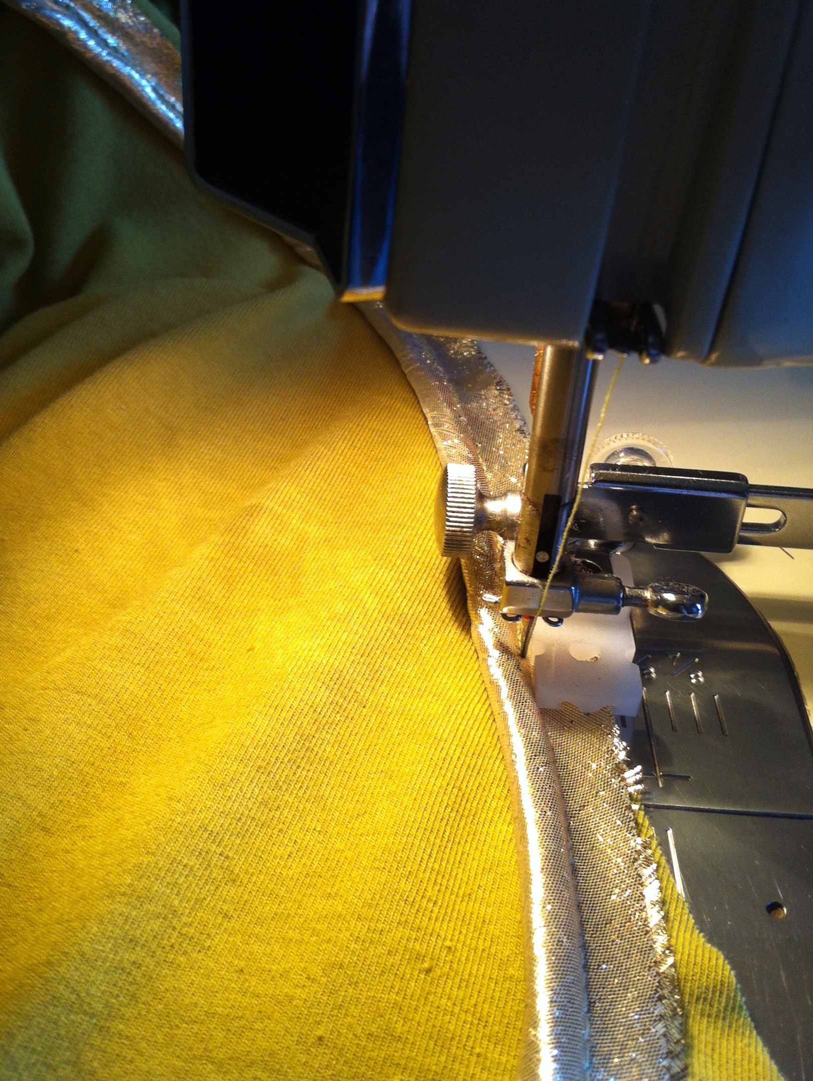 a view of the sewing machine stitching on a fabric