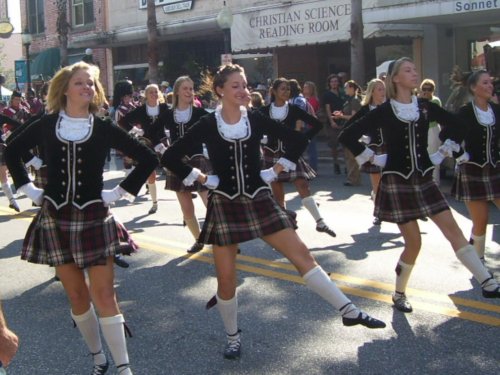 the girls in uniform are dancing on the street
