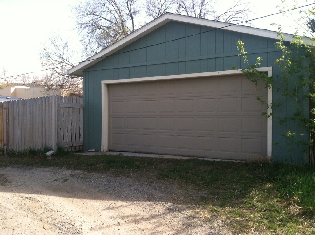 a garage door is opened on a house