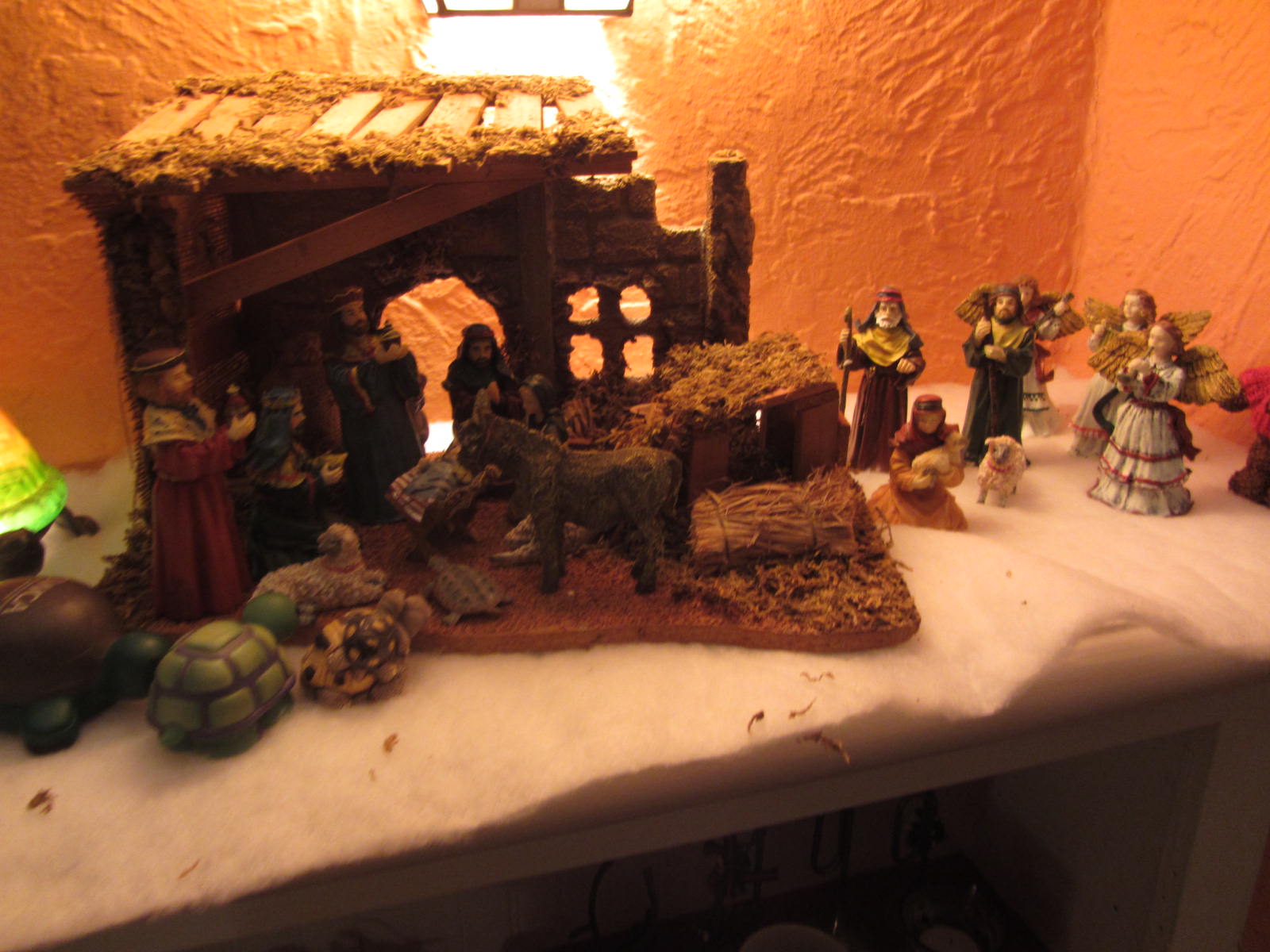 a group of toys in a nativity scene on a table