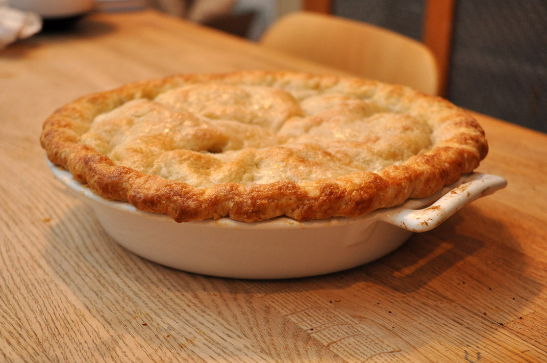 an image of a dish on the table with pie crust in it