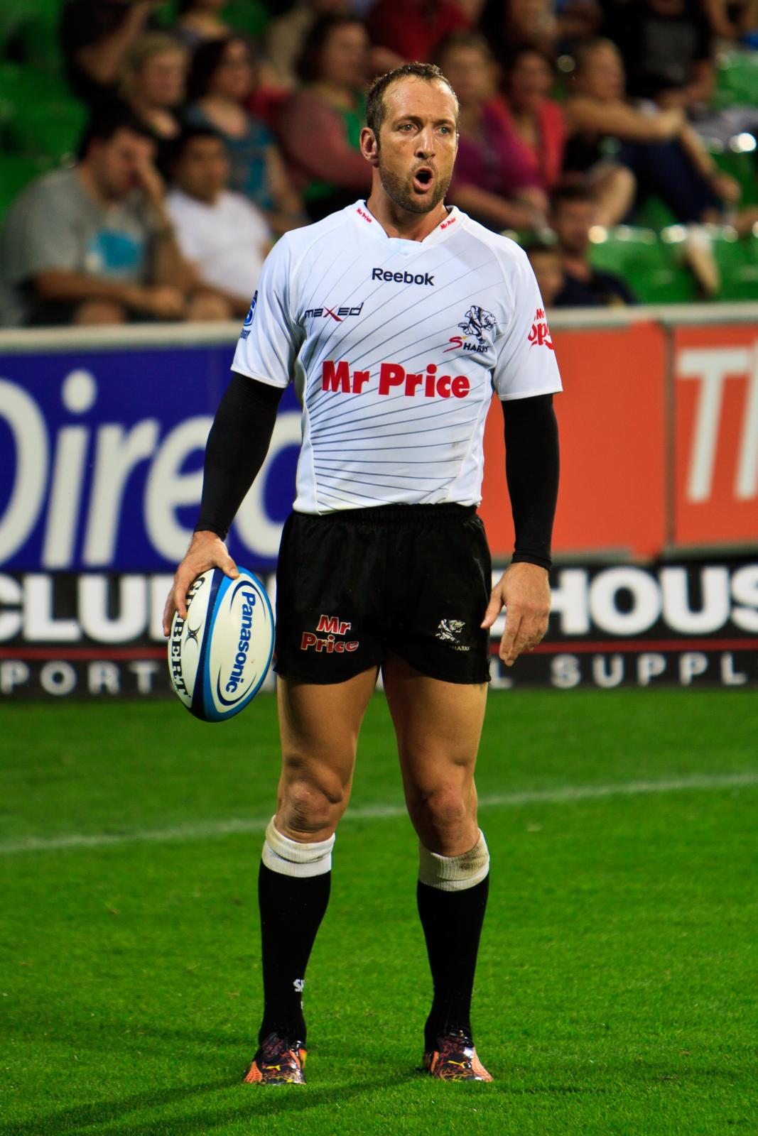 a man wearing a uniform standing in a field