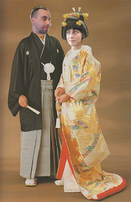 an oriental man and woman dressed in costumes