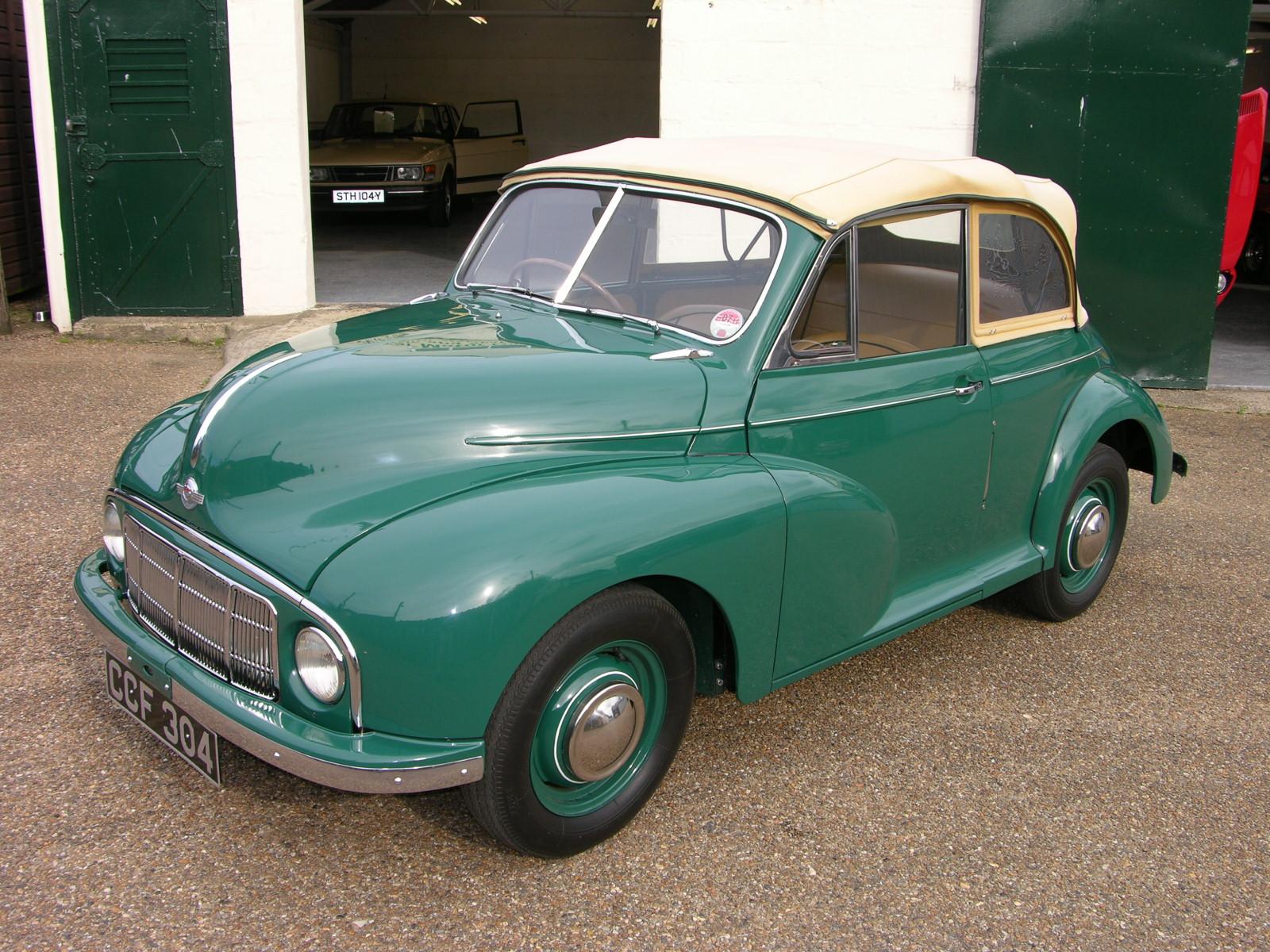 a very classic car parked in a garage