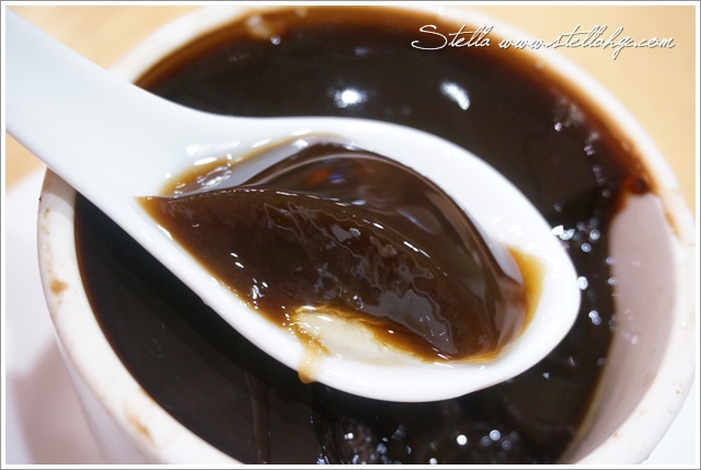 a spoon is stuck in to chocolate sauce