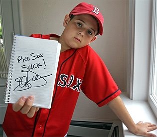  holding a baseball book and signed by the baseball player