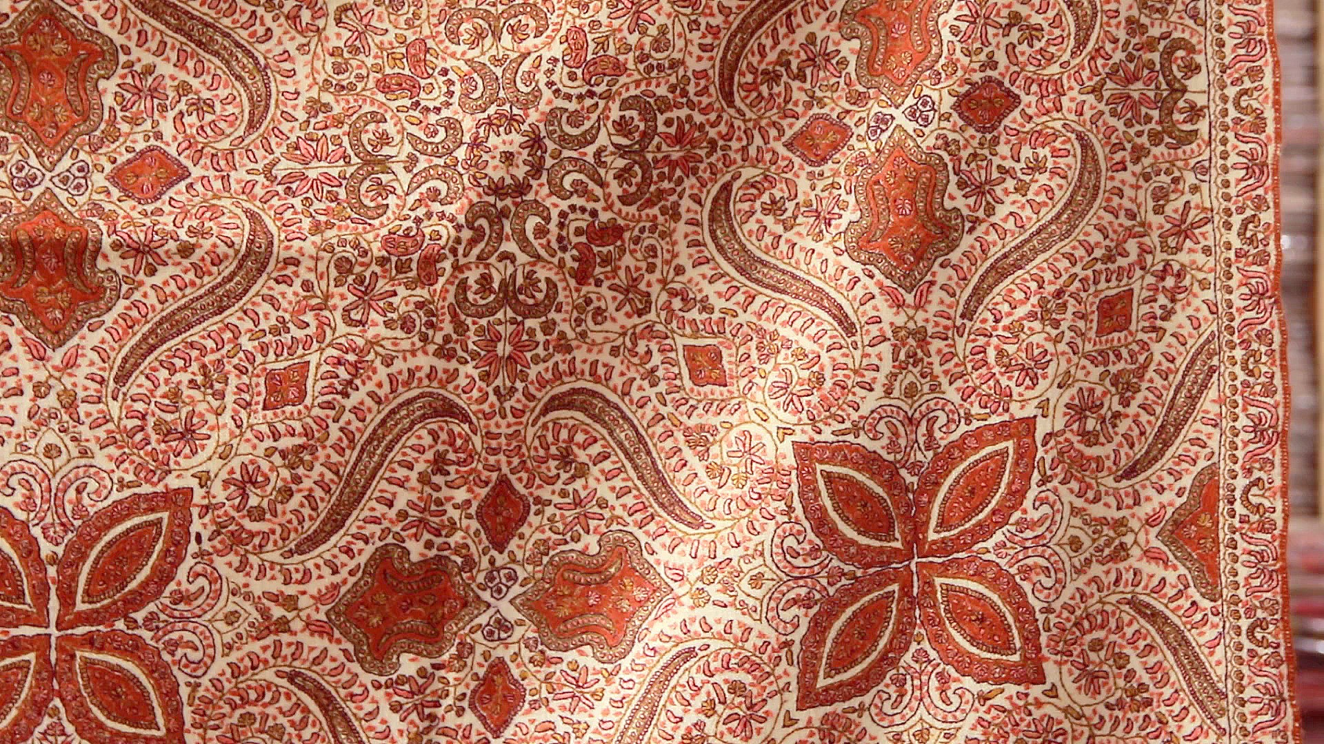 an intricate floral pattern on an un - stitched fabric
