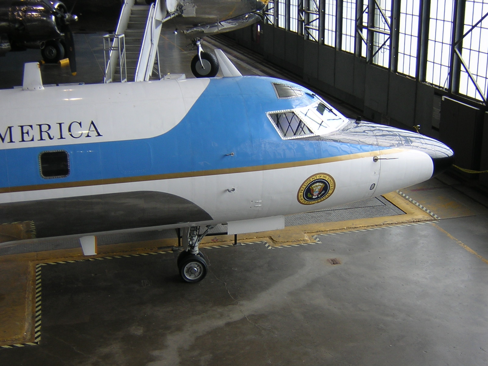 an image of a plane parked inside of a terminal