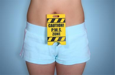 a sign that says caution pms zone on the side of the stomach