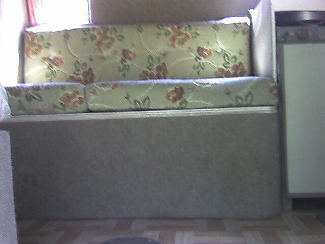 the couch is in front of the window