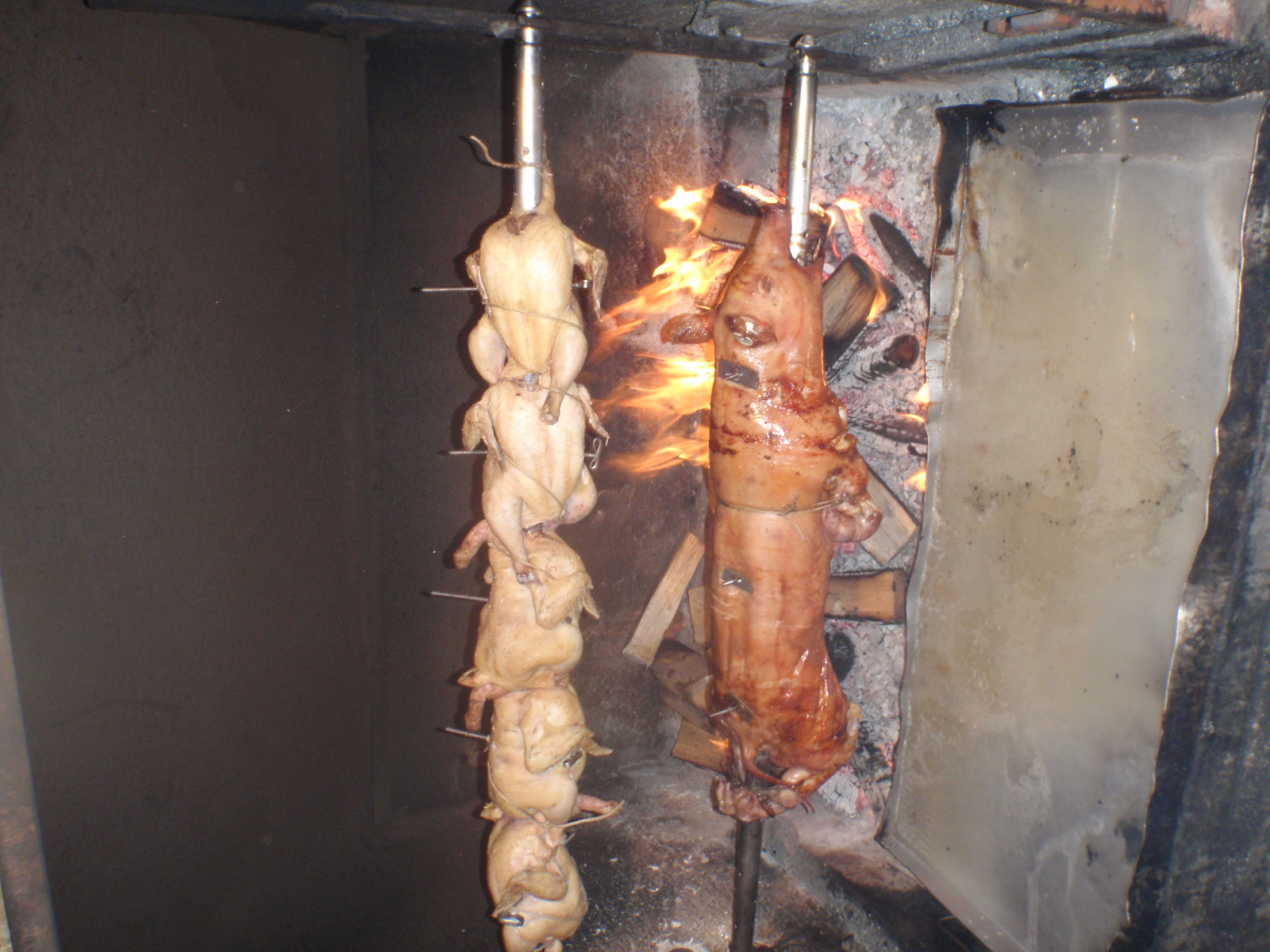 meats are being prepared for cooking in a kitchen