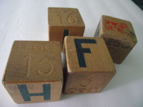 three wooden dices are stacked up on top of each other