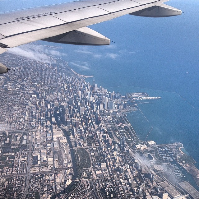 view from airplane as it flies above the city