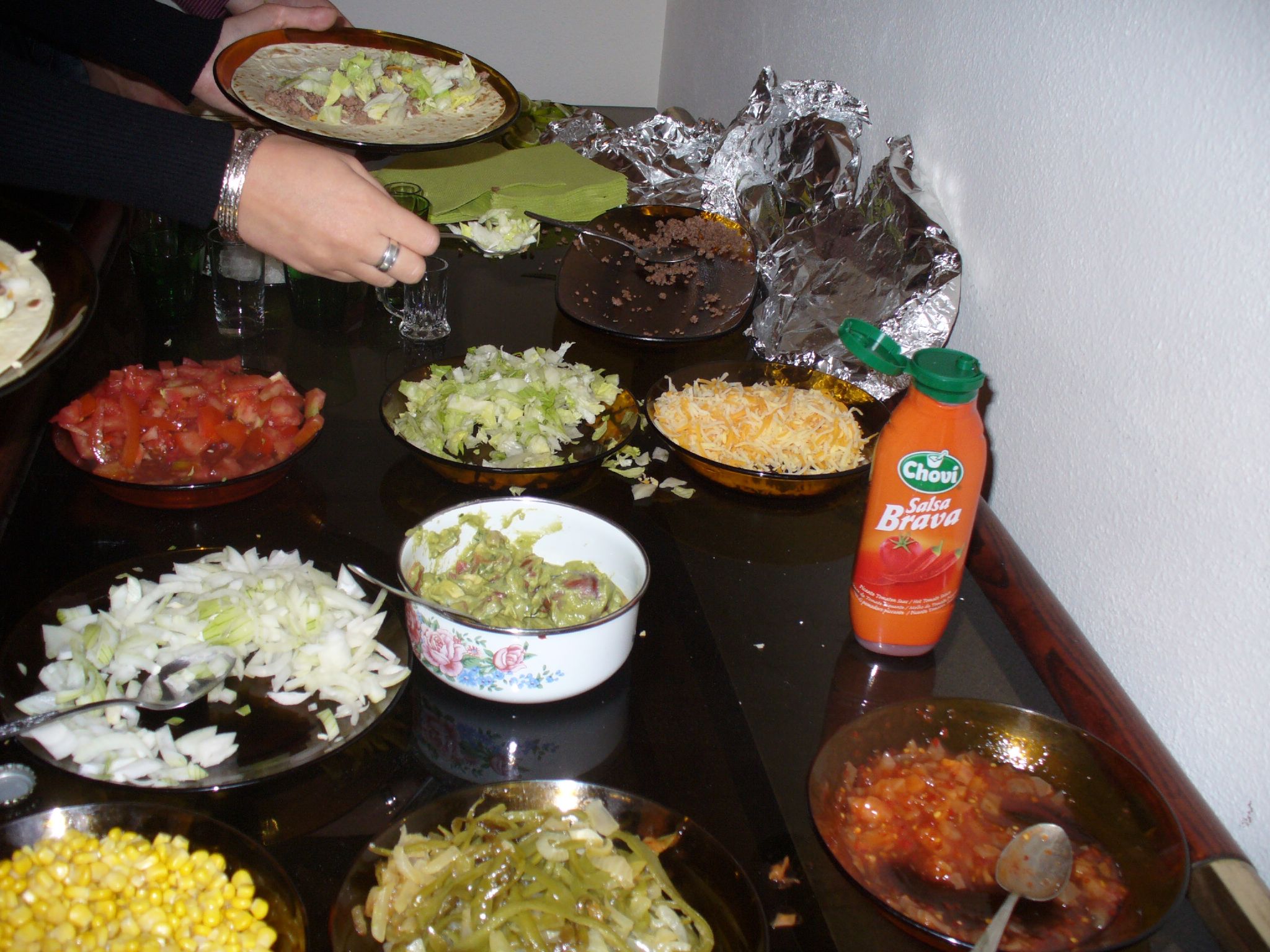 someone is preparing various food on a counter