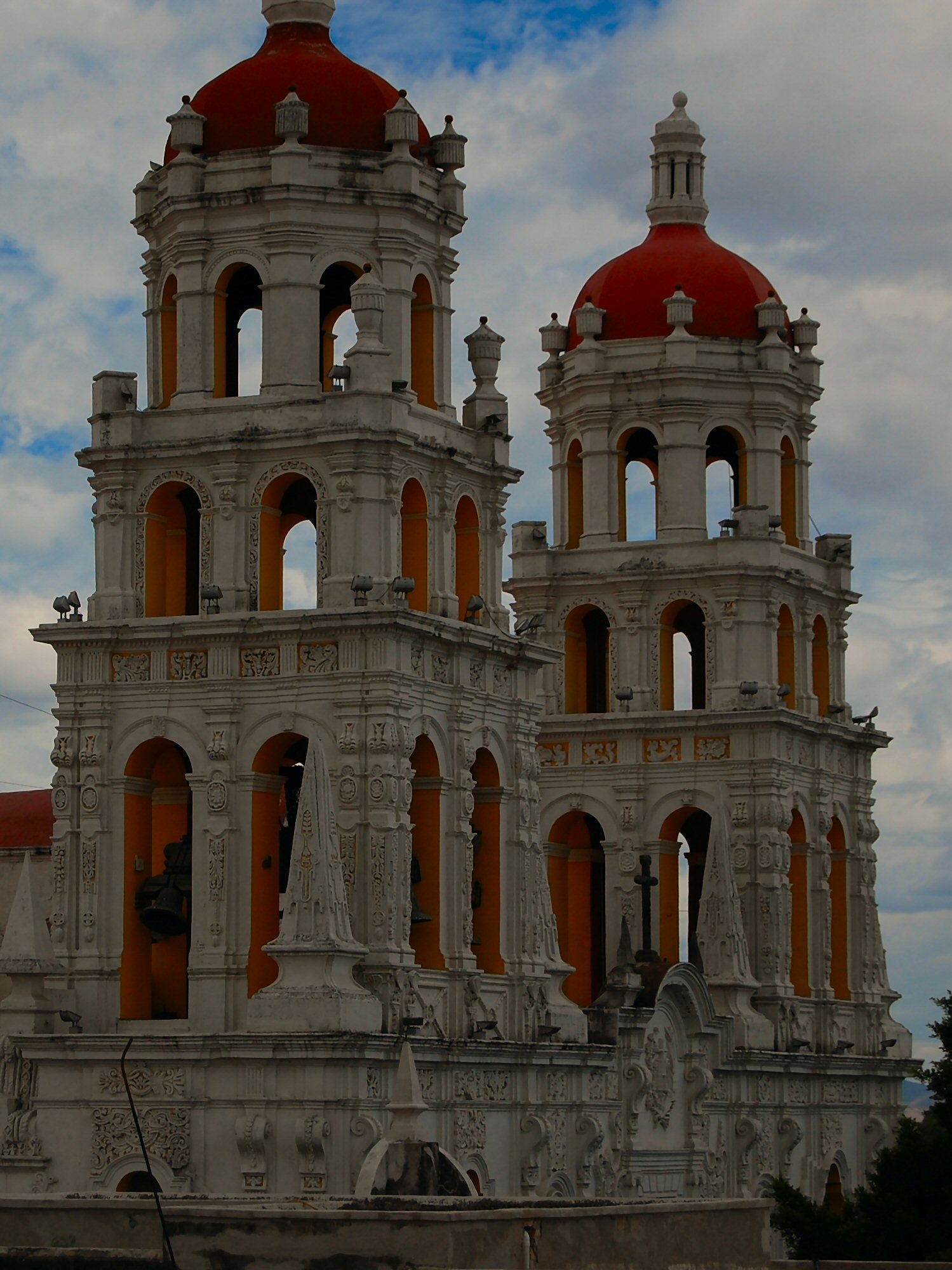 a very large, ornate building with red roof tops