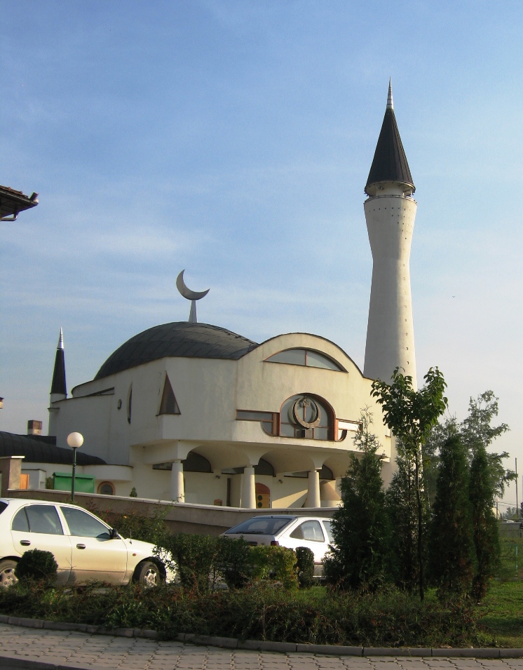 the building is very large and has a pointed roof