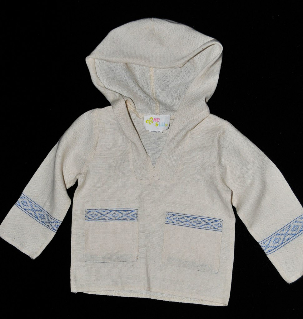 a child's white sweater jacket with blue trims
