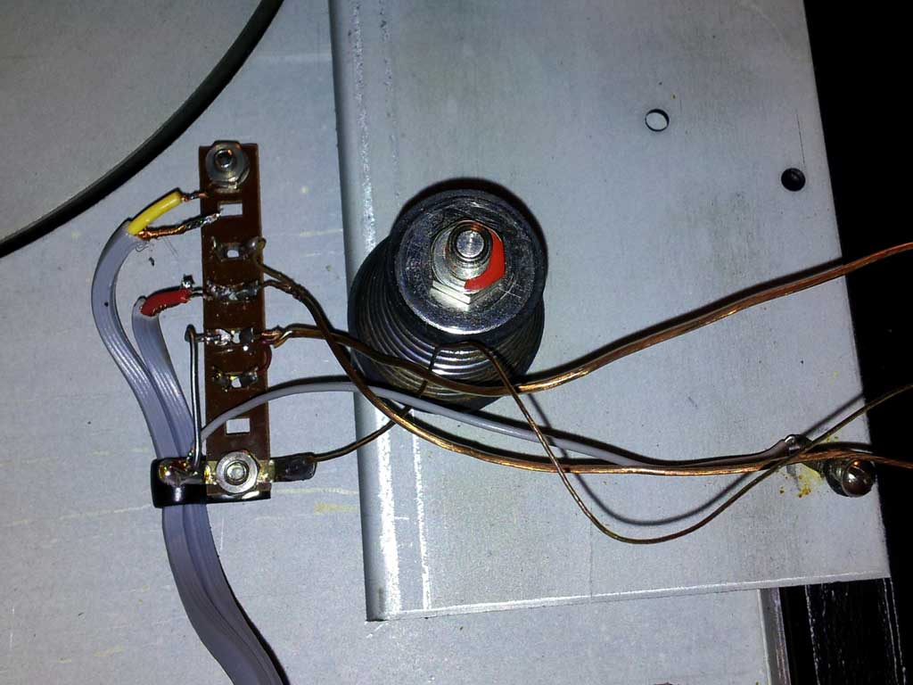 a circuit box with an electric outlet and wires in it