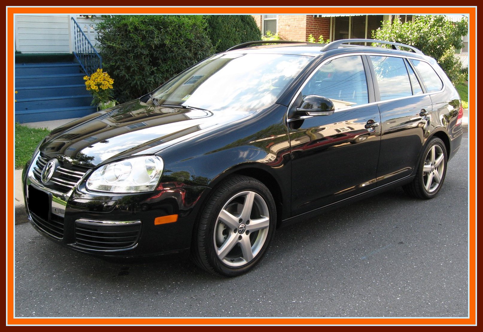 a black golf v station wagon is shown