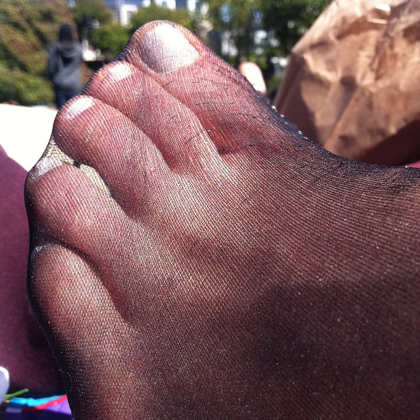 a person's legs and toe that are covering them