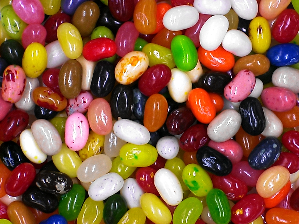 a pile of colorful candy coated nuts on top of each other