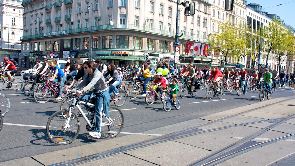 some people on bikes riding in the street