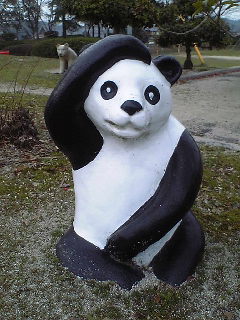 a giant statue of a panda in a hood