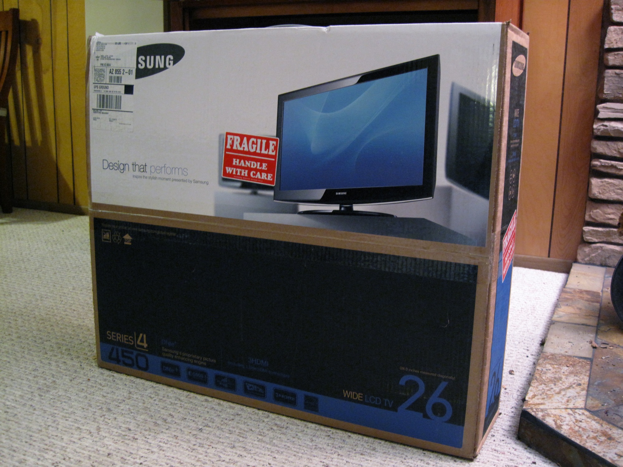 a boxed television set with a price tag