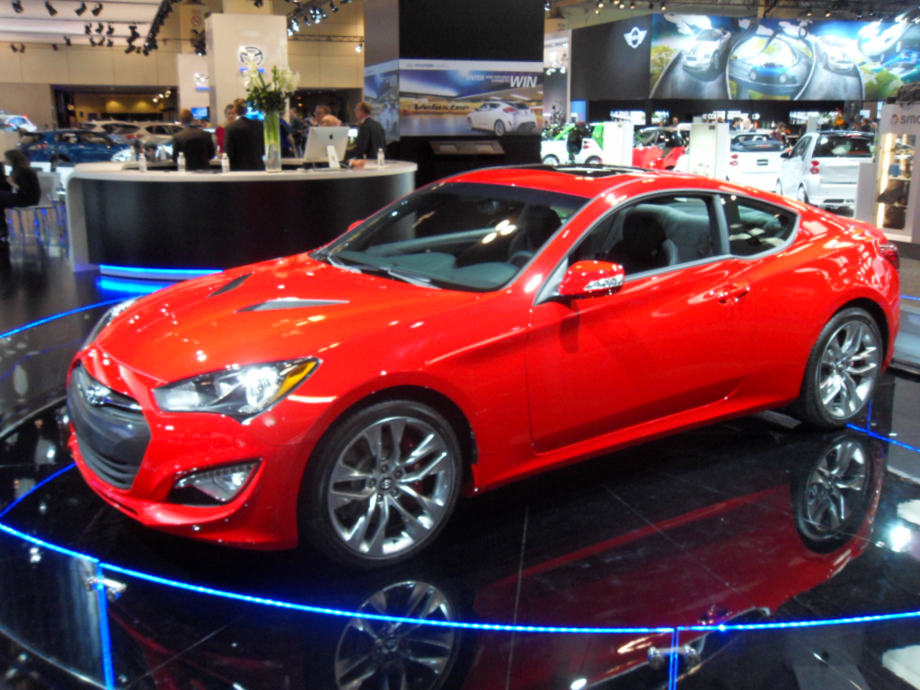 a red car on display in a store