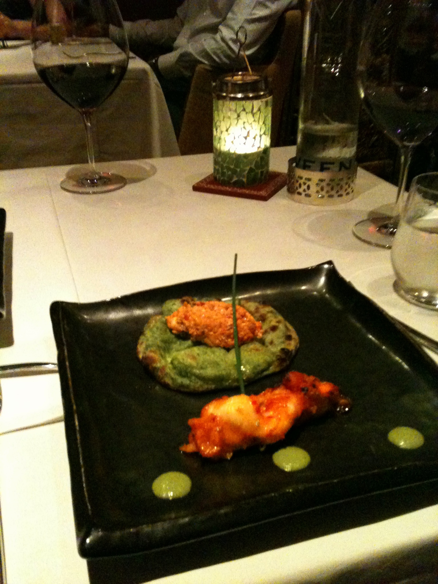 a dinner dish on top of a black tray