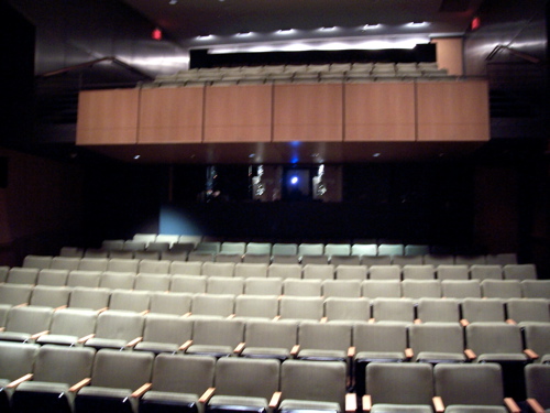 empty auditorium seats inside a building with no people