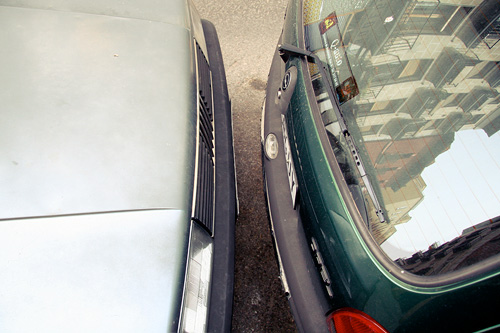 a car has a broken windshield in a parking lot