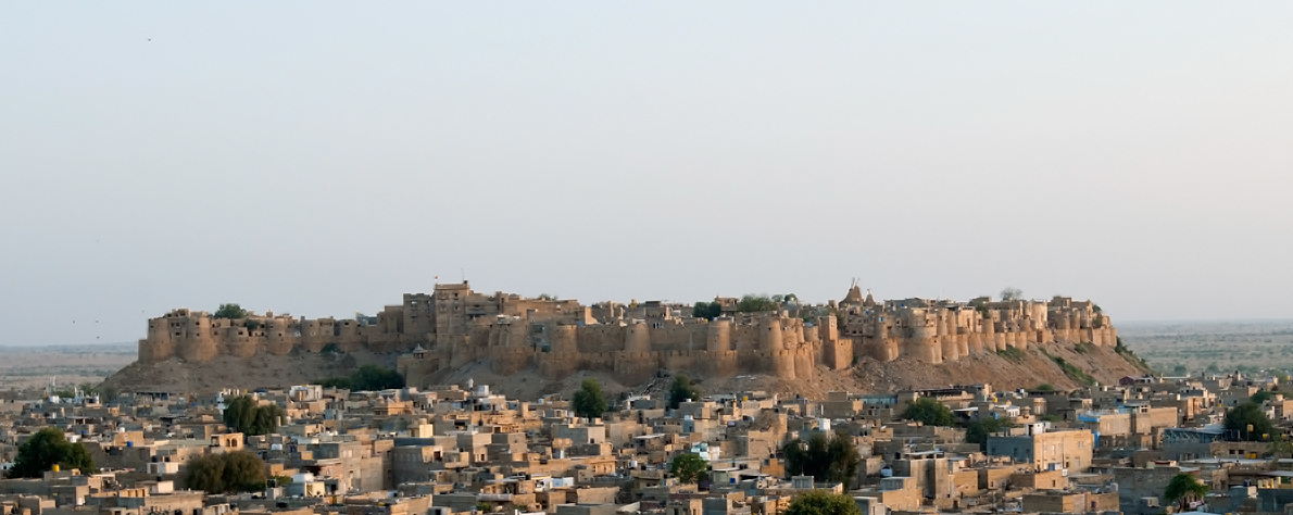 a view of a very big and pretty city with an ancient castle