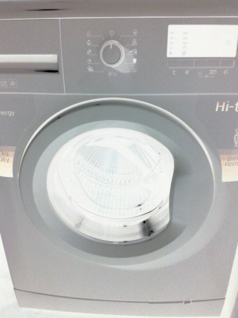 a washing machine with ons inside of it