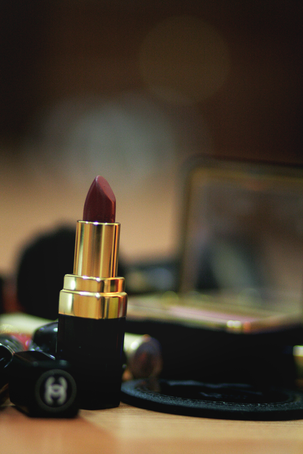a close up of a lipstick on a desk