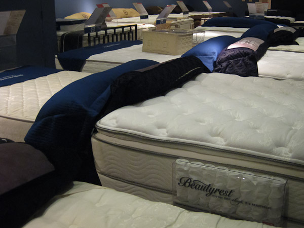 various mattresses on display at a store