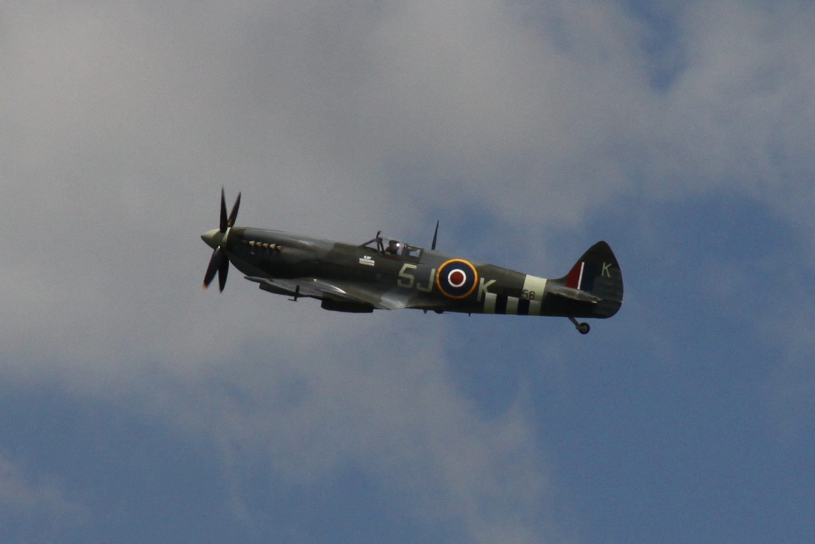 an old world war i fighter plane flies overhead