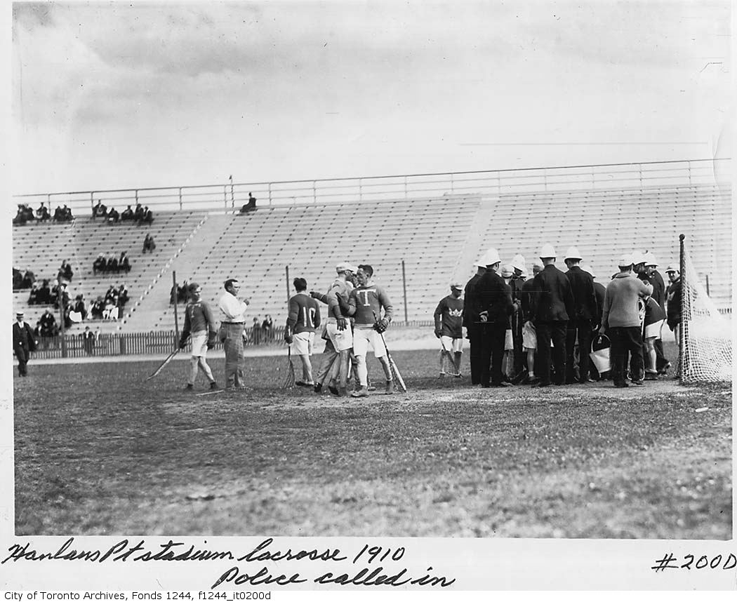 a group of people stand together at the ball game